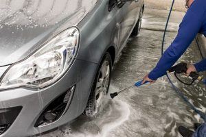 Tires being cleaned with high pressure