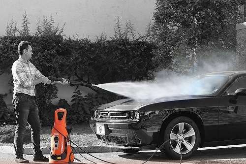 cleaning a car with an electric pressure washer