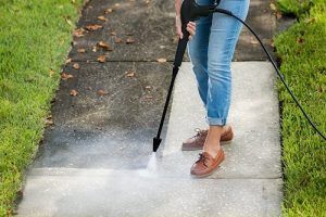 cleaning pavement with an electric pressure washer